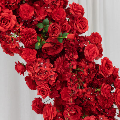 Red floral arrangement with roses and blossoms on a white background. #whtbkgd