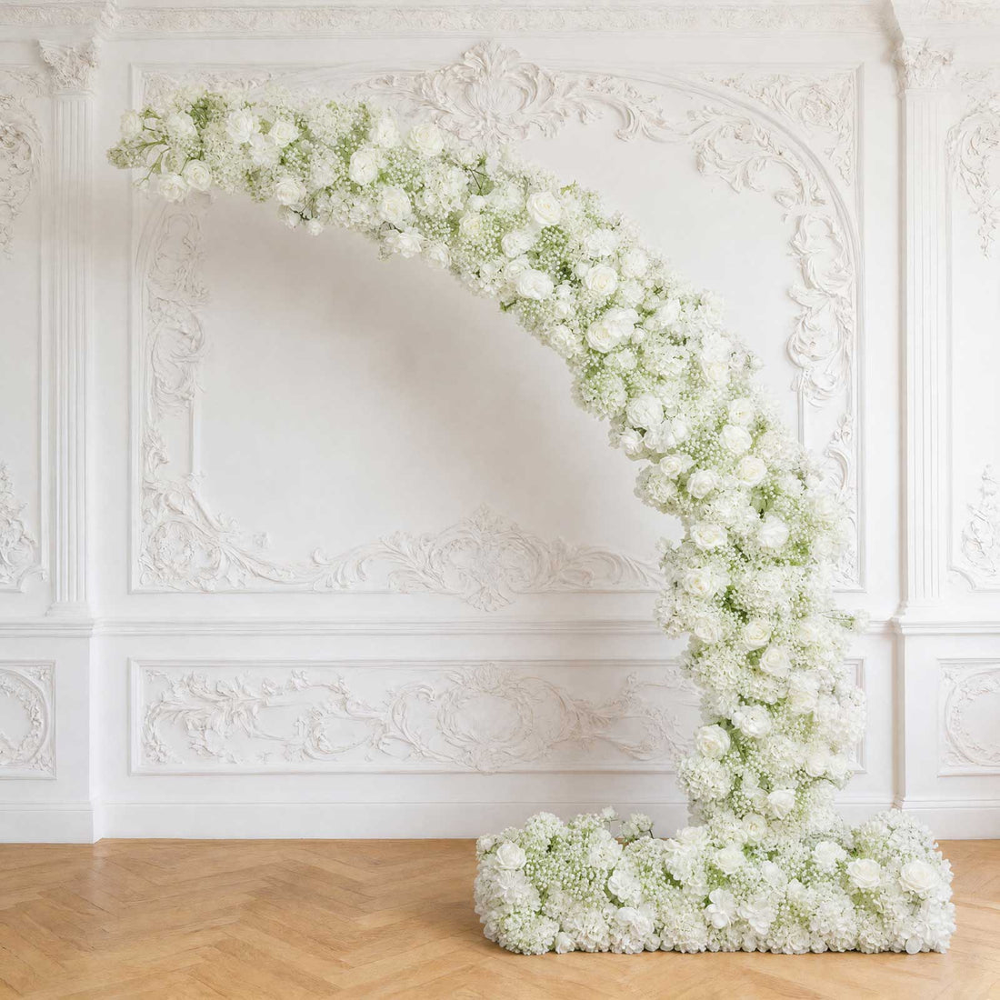 Elegant white floral arch arrangement in a classic ornate room
