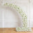 Elegant white floral arch arrangement in a classic ornate room