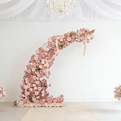 Floral arch arrangement with pink roses and flowers on a white background.