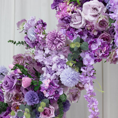 Purple floral arrangement with roses, peonies, and greenery. #whtbkgd