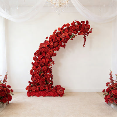 Red floral arch decoration for events and weddings.