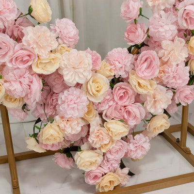 Pastel pink and cream artificial flower wall backdrop with gold frame
