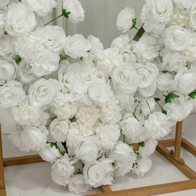 White artificial flower arrangement on gold stand, decorative floral backdrop
