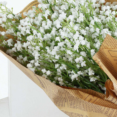 White flowers wrapped in vintage newspaper.