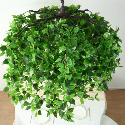 Artificial hanging plant chandelier with lush green leaves.