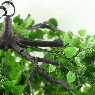 Artificial plant branch with lush green leaves and realistic brown stem