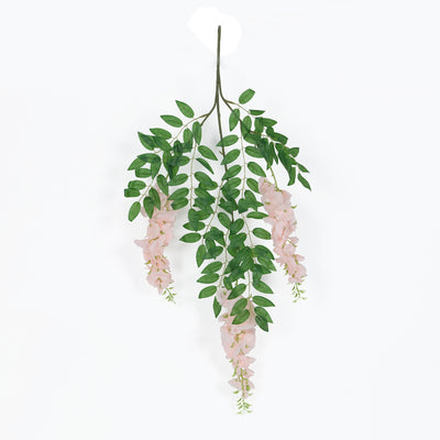 Pink floral hanging decor with green leaves on a white background