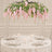 Elegant round table setting with pink floral hanging centerpiece and candles