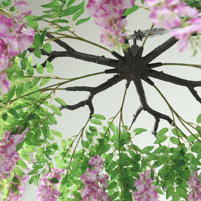 Artificial wisteria hanging decoration with vibrant purple flowers and green leaves.