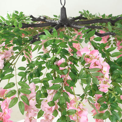 Artificial pink flower chandelier with lush green leaves
