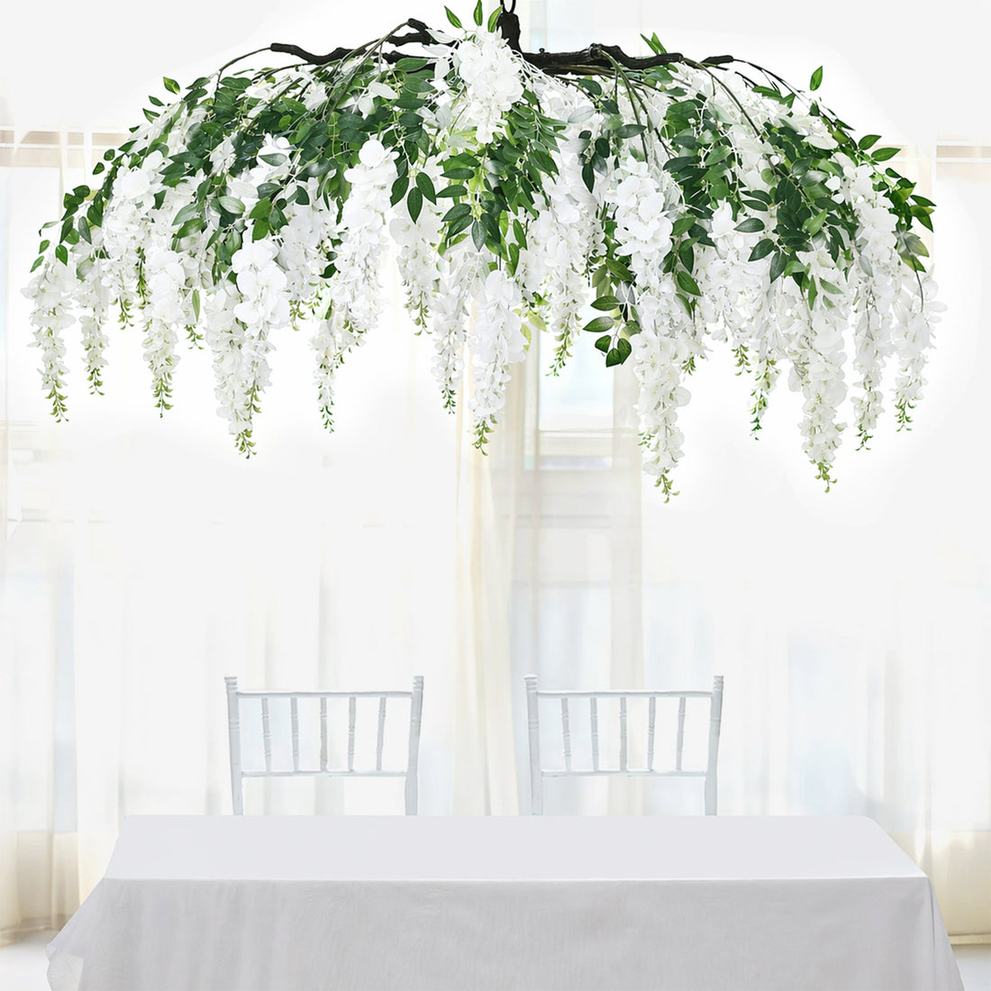 Artificial flower chandelier with greenery and white blooms, perfect for decor.