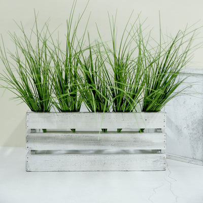 Decorative wooden planter with artificial grass.