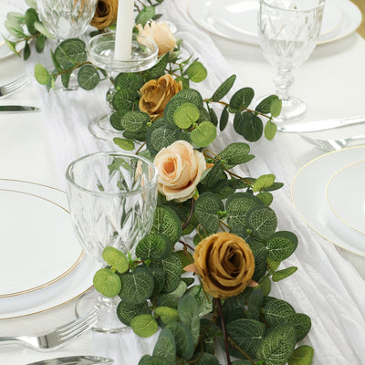 Elegant table setting with greenery and floral accents for special occasions.