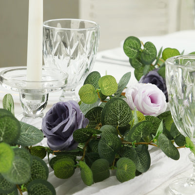 Decorative table setting with flowers and glassware.
