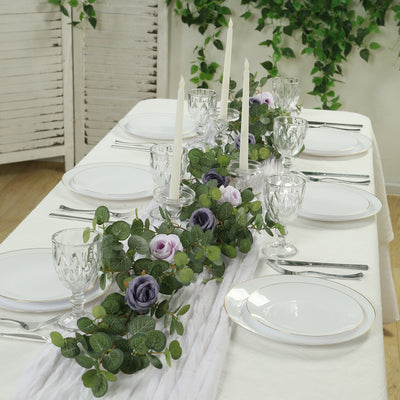 Elegant table setting with floral centerpiece and candles for special occasions.