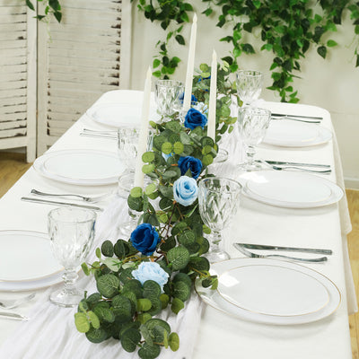 Elegant table setting with floral centerpiece and candles for a special occasion.