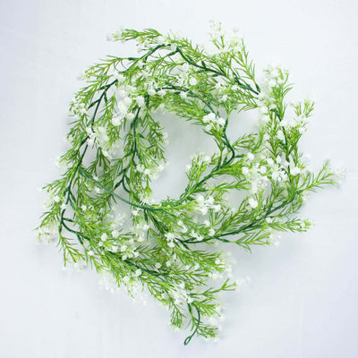 Artificial white flower wreath with green foliage