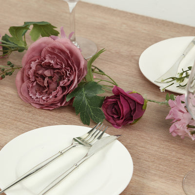 Elegant table setting with floral accents and dinnerware.