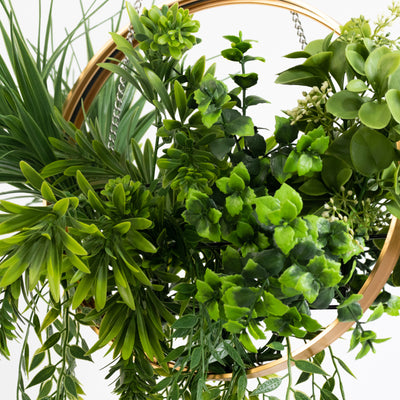 Artificial hanging plant arrangement in a decorative gold hoop.
