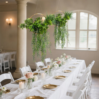 Hanging greenery centerpiece for elegant dining setup.