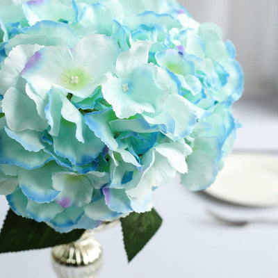 Artificial hydrangea flower bouquet in soft blue and green hues.