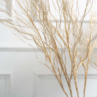Gold decorative branches in a minimalist design.