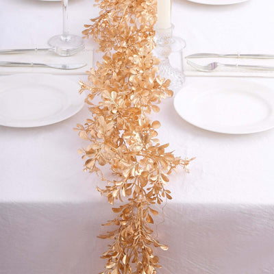 Gold leaf table runner for elegant dining decor.