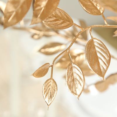 Golden leaf decoration with intricate details and shine. #whtbkgd