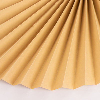 Brown pleated paper fan on a white background