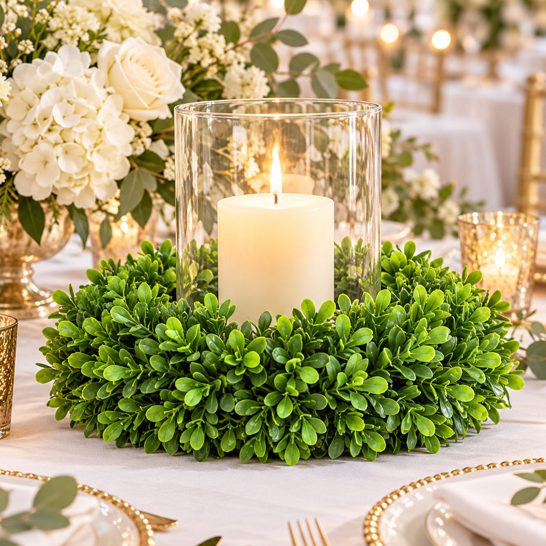 Elegant candle centerpiece with greenery and white floral wedding table decor