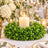 Elegant candle centerpiece with greenery and white floral wedding table decor