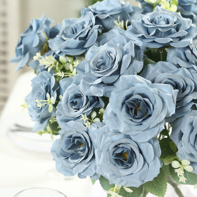 Blue artificial roses bouquet arrangement in a decorative setting.