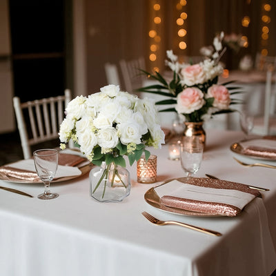 Elegant floral centerpiece on a beautifully set dining table.