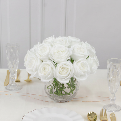 White rose bouquet in a glass vase on a dining table
