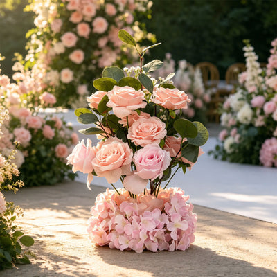 Pastel wedding floral arrangement in sunlit garden setting