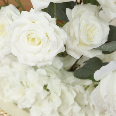 White artificial roses and flowers in a decorative arrangement