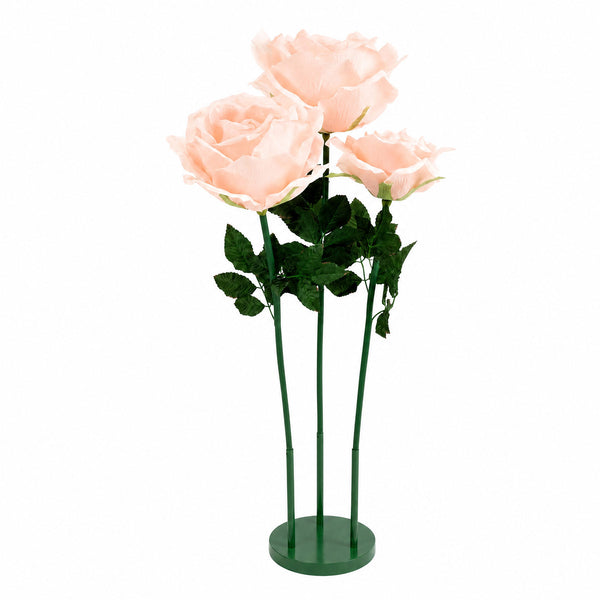 Artificial pink rose bouquet on green stems with leaves, isolated on white background