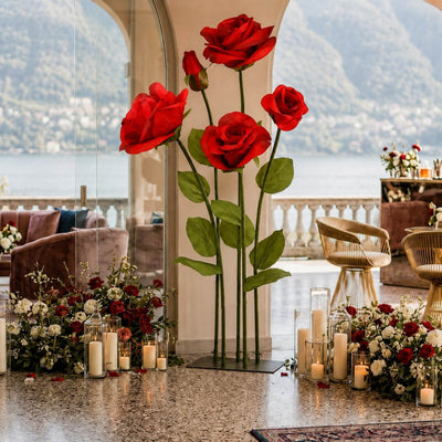 Elegant rose floral wedding decor with candles and waterfront view