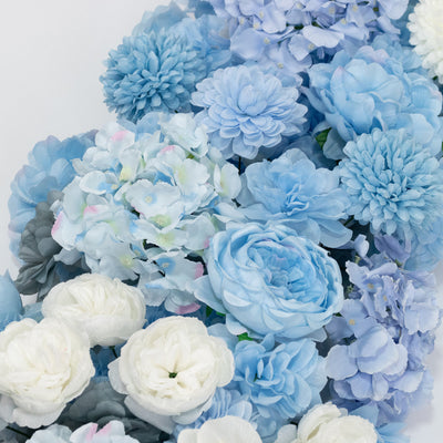 Soft blue and white artificial flowers bouquet on a white background