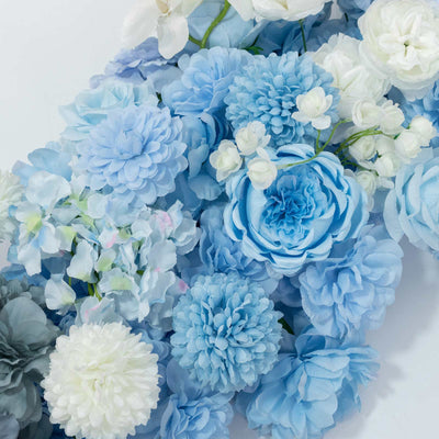 Blue and white floral arrangement with hydrangeas and roses