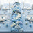 Blue floral table setting with elegant glassware and candles