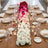 Elegant floral wedding table centerpiece with pink and white roses and gold tableware