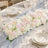 Elegant pastel wedding table centerpiece with roses, hydrangeas, and candles