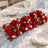 Elegant red floral table centerpiece for wedding reception decor