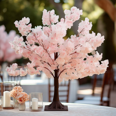 Pink cherry blossom tree centerpiece for elegant table decor.