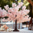 Pink cherry blossom tree centerpiece for elegant table decor.
