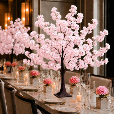 Elegant pink cherry blossom table centerpiece at a luxury dining event