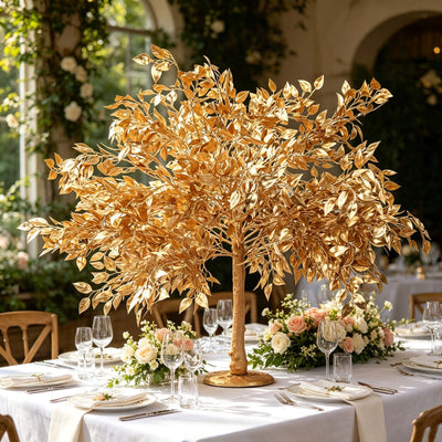Gold leaf tree centerpiece at an elegant wedding reception table