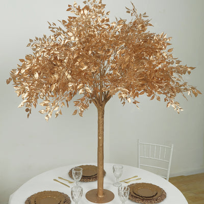 Gold decorative tree centerpiece for elegant table settings.